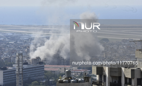 Smoke rises from the site of an Israeli airstrike that targets a neighborhood in Beirut's southern suburbs on November 12, 2024. 