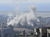 Smoke rises from the site of an Israeli airstrike that targets a neighborhood in Beirut's southern suburbs on November 12, 2024. (