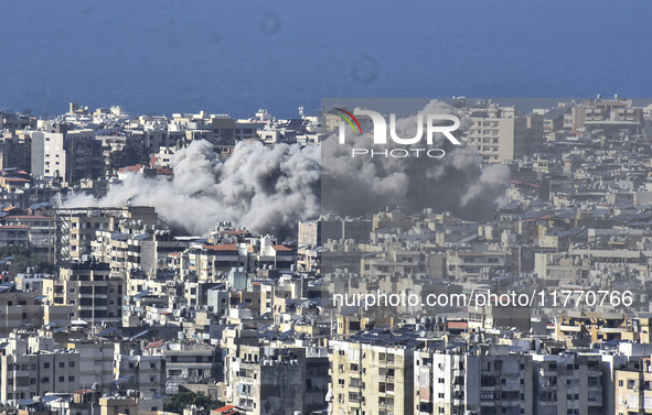 Smoke rises from the site of an Israeli airstrike that targets a neighborhood in Beirut's southern suburbs on November 12, 2024. 