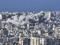 Smoke rises from the site of an Israeli airstrike that targets a neighborhood in Beirut's southern suburbs on November 12, 2024. (