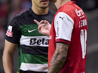 Maxi Araujo of Sporting CP and Joao Ferreira of SC Braga discuss during the Liga Portugal Betclic match between SC Braga and Sporting CP at...