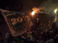 Fans of Sporting CP light flares in the stand during the Liga Portugal Betclic match between SC Braga and Sporting CP at Estadio Municipal d...