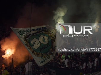 Fans of Sporting CP light flares in the stand during the Liga Portugal Betclic match between SC Braga and Sporting CP at Estadio Municipal d...