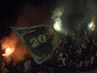 Fans of Sporting CP light flares in the stand during the Liga Portugal Betclic match between SC Braga and Sporting CP at Estadio Municipal d...