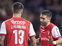 Joao Moutinho of SC Braga talks with Joao Ferreira of SC Braga during the Liga Portugal Betclic match between SC Braga and Sporting CP at Es...