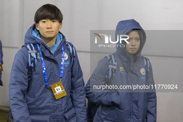 Yui Hasegawa #25 of Manchester City W.F.C. and Aoba Fujino #20 of Manchester City W.F.C. arrive at the Joie Stadium during the UEFA Champion...