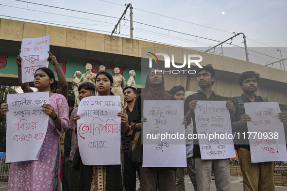 Dhaka University students protest the brutal murder of a female ready-made garment worker and demand justice at the Raju Memorial Sculpture...