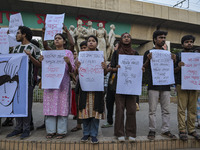 Dhaka University students protest the brutal murder of a female ready-made garment worker and demand justice at the Raju Memorial Sculpture...