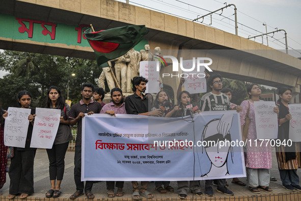 Dhaka University students protest the brutal murder of a female ready-made garment worker and demand justice at the Raju Memorial Sculpture...