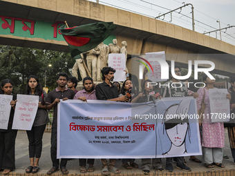 Dhaka University students protest the brutal murder of a female ready-made garment worker and demand justice at the Raju Memorial Sculpture...