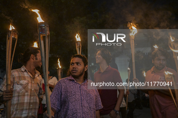 The Bangladesh Students Union holds a torch procession protesting the murder of a female ready-made garment worker and demanding justice in...