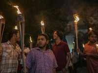 The Bangladesh Students Union holds a torch procession protesting the murder of a female ready-made garment worker and demanding justice in...