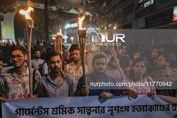 The Bangladesh Students Union holds a torch procession protesting the murder of a female ready-made garment worker and demanding justice in...