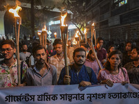 The Bangladesh Students Union holds a torch procession protesting the murder of a female ready-made garment worker and demanding justice in...