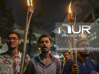 The Bangladesh Students Union holds a torch procession protesting the murder of a female ready-made garment worker and demanding justice in...