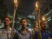 The Bangladesh Students Union holds a torch procession protesting the murder of a female ready-made garment worker and demanding justice in...