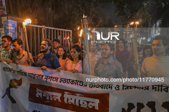 The Bangladesh Students Union holds a torch procession protesting the murder of a female ready-made garment worker and demanding justice in...