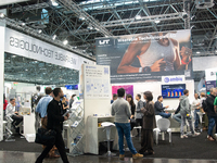 Fairgoers are seen at the WT wearable technology booth at Medica 2024 at the Duesseldorf exhibition center in Duesseldorf, Germany, on Novem...