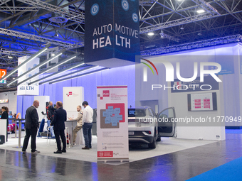 Fairgoers are seen at the Auto Health booth at Medica 2024 at the Duesseldorf exhibition center in Duesseldorf, Germany, on November 12, 202...