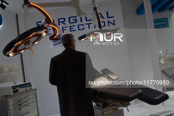 A fairgoer looks at a surgical chair at the Duesseldorf Exhibition Center in Duesseldorf, Germany, on November 12, 2024, during MEDICA 2024....