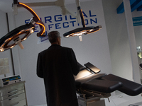 A fairgoer looks at a surgical chair at the Duesseldorf Exhibition Center in Duesseldorf, Germany, on November 12, 2024, during MEDICA 2024....