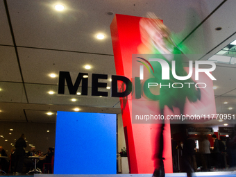 A fairgoer walks past the Medica installation at the Duesseldorf Exhibition Center in Duesseldorf, Germany, on November 12, 2024, during MED...