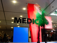 A fairgoer walks past the Medica installation at the Duesseldorf Exhibition Center in Duesseldorf, Germany, on November 12, 2024, during MED...