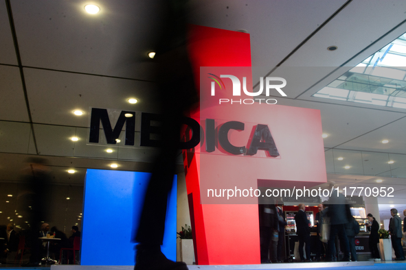 A fairgoer walks past the Medica installation at the Duesseldorf Exhibition Center in Duesseldorf, Germany, on November 12, 2024, during MED...