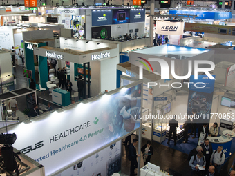 Fairgoers are seen at Medica 2024 at Duesseldorf Exhibition Center in Duesseldorf, Germany, on November 12, 2024. (