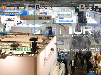 Fairgoers are seen at Medica 2024 at Duesseldorf Exhibition Center in Duesseldorf, Germany, on November 12, 2024. (