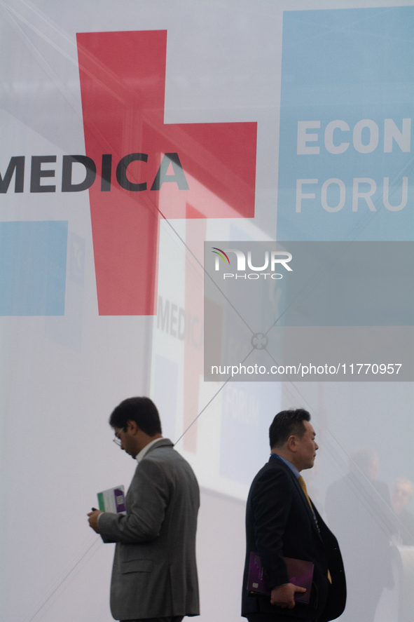 Fairgoers walk past the MEDICA logo at Medica 2024 at the Duesseldorf Exhibition Center in Duesseldorf, Germany, on November 12, 2024. 