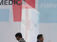 Fairgoers walk past the MEDICA logo at Medica 2024 at the Duesseldorf Exhibition Center in Duesseldorf, Germany, on November 12, 2024. (