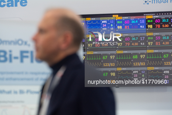 A fairgoer walks past a medical monitor at Medica 2024 at the Duesseldorf exhibition center in Duesseldorf, Germany, on November 12, 2024. 