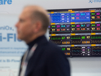 A fairgoer walks past a medical monitor at Medica 2024 at the Duesseldorf exhibition center in Duesseldorf, Germany, on November 12, 2024. (