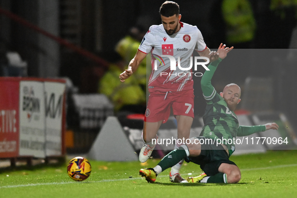 Nick Freeman (7, Stevenage) is challenged by Jonny Williams (10, Gillingham) during the EFL Trophy match between Stevenage and Gillingham at...