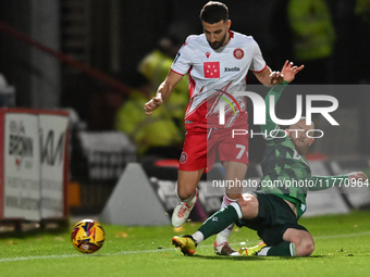 Nick Freeman (7, Stevenage) is challenged by Jonny Williams (10, Gillingham) during the EFL Trophy match between Stevenage and Gillingham at...