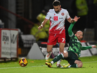 Nick Freeman (7, Stevenage) is challenged by Jonny Williams (10, Gillingham) during the EFL Trophy match between Stevenage and Gillingham at...