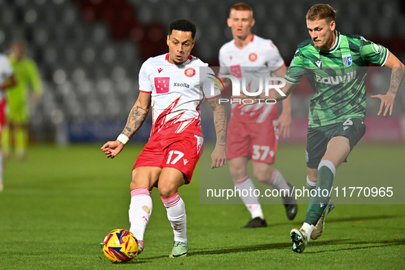 Elliot List (17 Stevenage) is challenged by Ethan Coleman (6 Gillingham) during the EFL Trophy match between Stevenage and Gillingham at the...