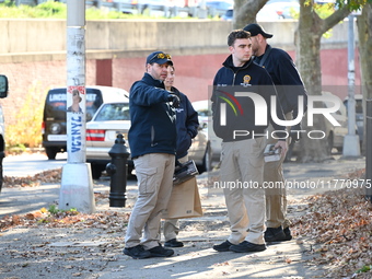 Evidence markers indicate where blood and other evidence is found after a 21-year-old man is fatally stabbed at Steuben Park in Brooklyn, Ne...