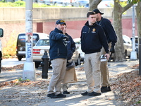 Evidence markers indicate where blood and other evidence is found after a 21-year-old man is fatally stabbed at Steuben Park in Brooklyn, Ne...