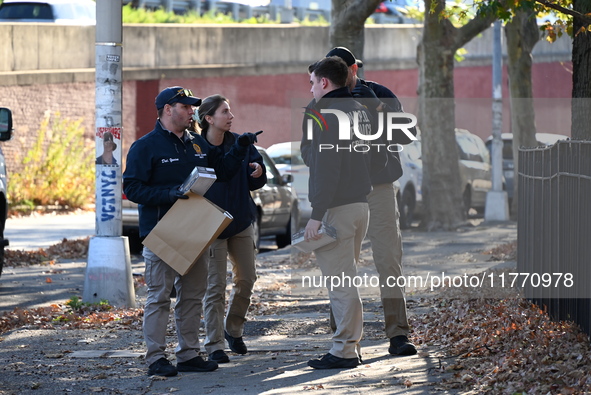 Evidence markers indicate where blood and other evidence is found after a 21-year-old man is fatally stabbed at Steuben Park in Brooklyn, Ne...