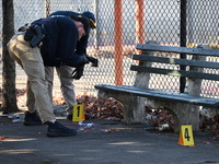 Evidence markers indicate where blood and other evidence is found after a 21-year-old man is fatally stabbed at Steuben Park in Brooklyn, Ne...