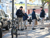 Evidence markers indicate where blood and other evidence is found after a 21-year-old man is fatally stabbed at Steuben Park in Brooklyn, Ne...