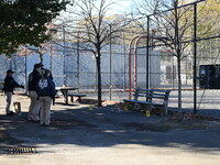 Evidence markers indicate where blood and other evidence is found after a 21-year-old man is fatally stabbed at Steuben Park in Brooklyn, Ne...