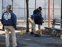 Evidence markers indicate where blood and other evidence is found after a 21-year-old man is fatally stabbed at Steuben Park in Brooklyn, Ne...