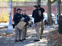 Evidence markers indicate where blood and other evidence is found after a 21-year-old man is fatally stabbed at Steuben Park in Brooklyn, Ne...