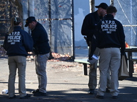 Evidence markers indicate where blood and other evidence is found after a 21-year-old man is fatally stabbed at Steuben Park in Brooklyn, Ne...