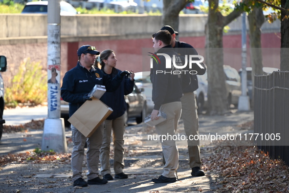 Evidence markers indicate where blood and other evidence is found after a 21-year-old man is fatally stabbed at Steuben Park in Brooklyn, Ne...