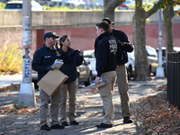 Evidence markers indicate where blood and other evidence is found after a 21-year-old man is fatally stabbed at Steuben Park in Brooklyn, Ne...