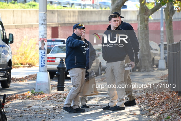 Evidence markers indicate where blood and other evidence is found after a 21-year-old man is fatally stabbed at Steuben Park in Brooklyn, Ne...